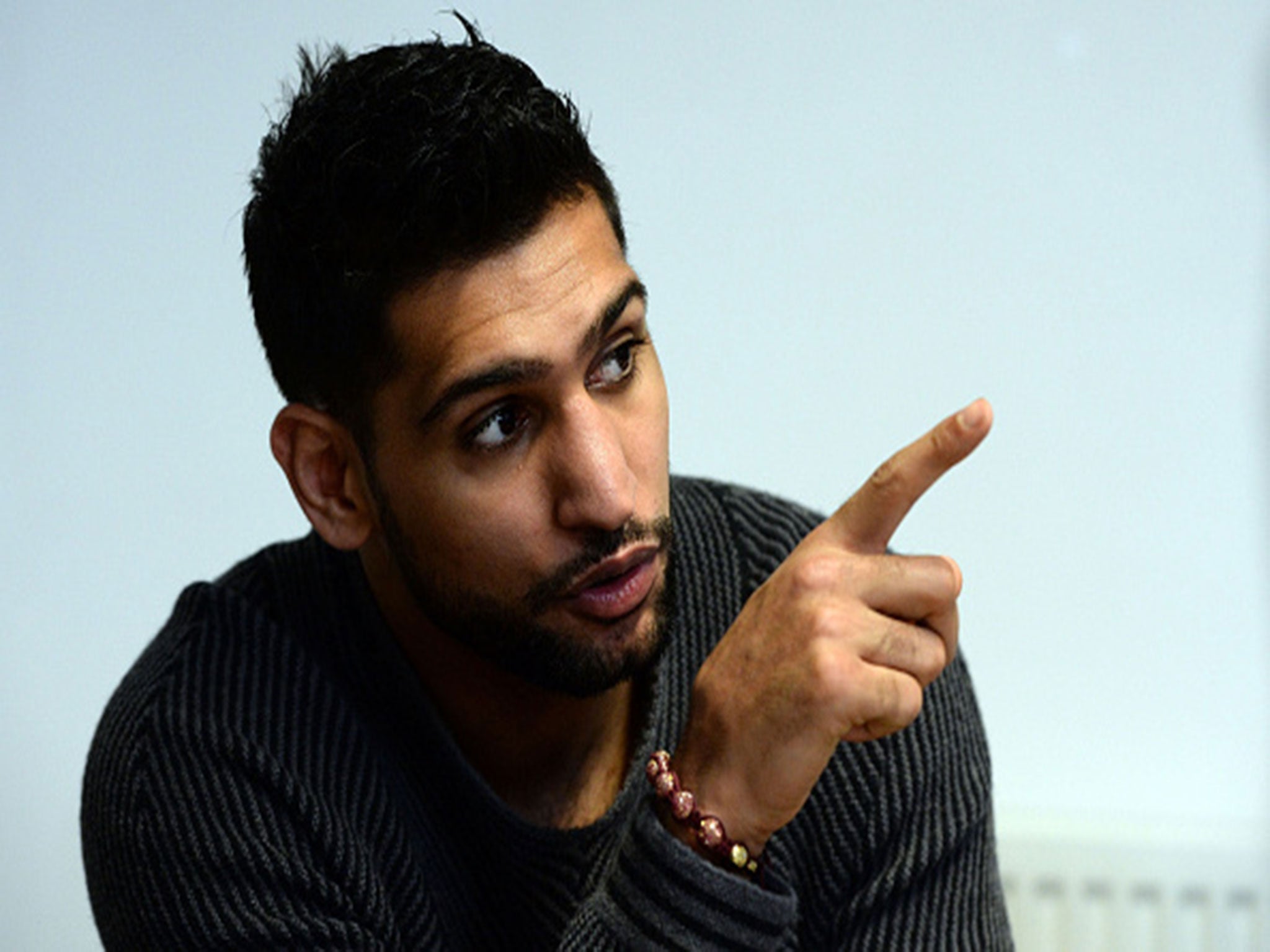 Amir Khan addresses a press conference in February