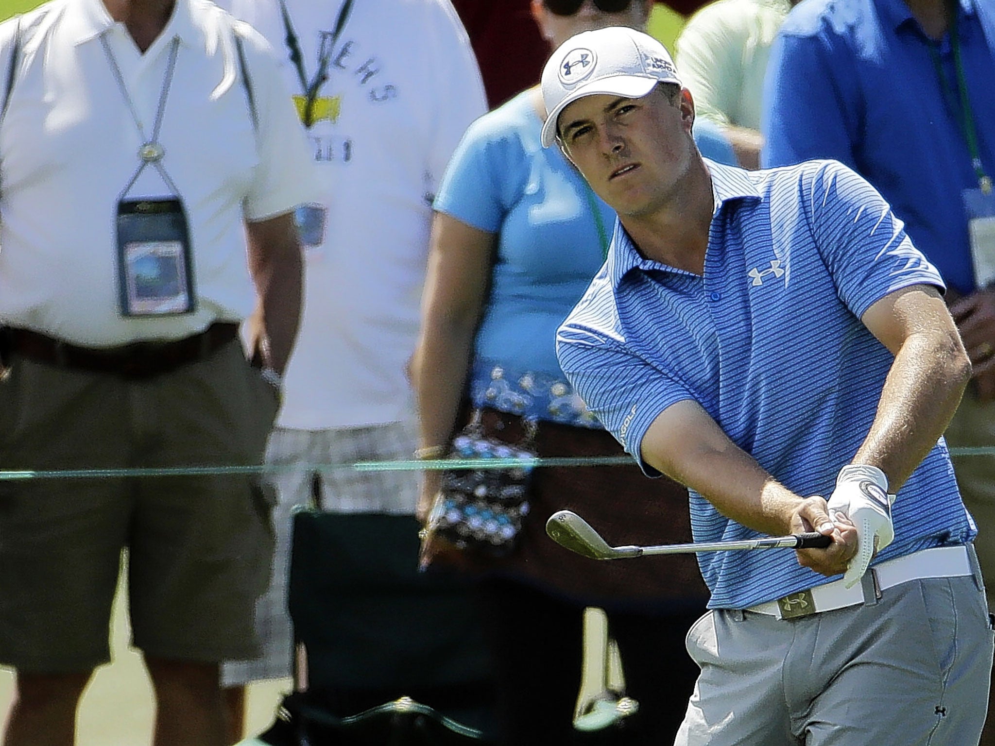 Jordan Spieth chips to the second green during the third round at Augusta yesterday