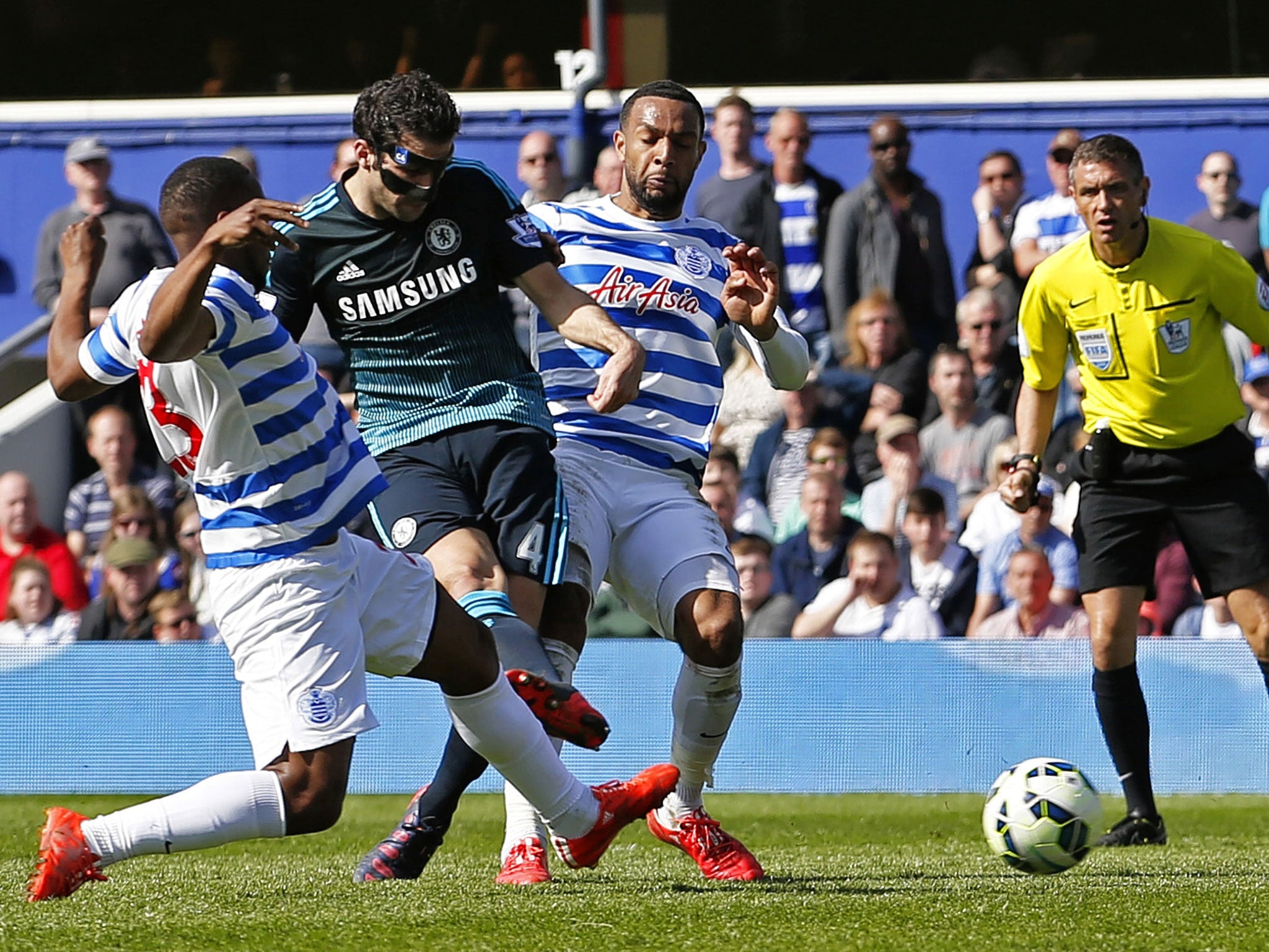 Cesc Fabregas (left) scores Chelsea’s late winner at Loftus Road