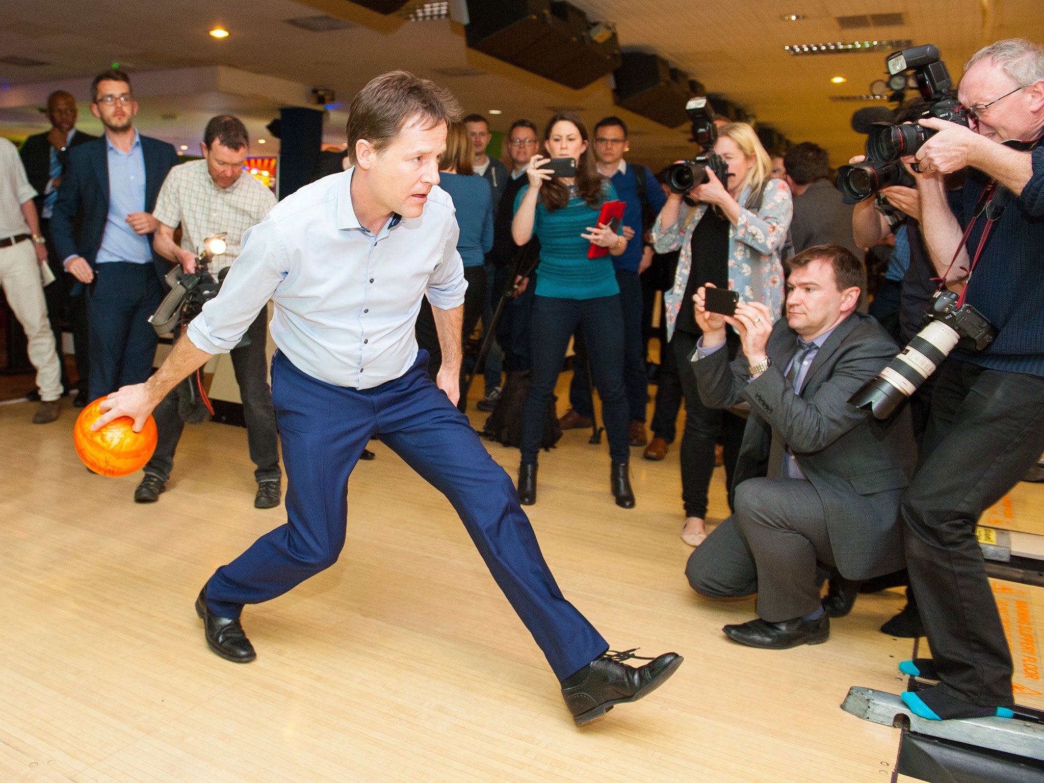 Nick Clegg shows off his prowess in the bowling alley during a campaign visit to Colchester