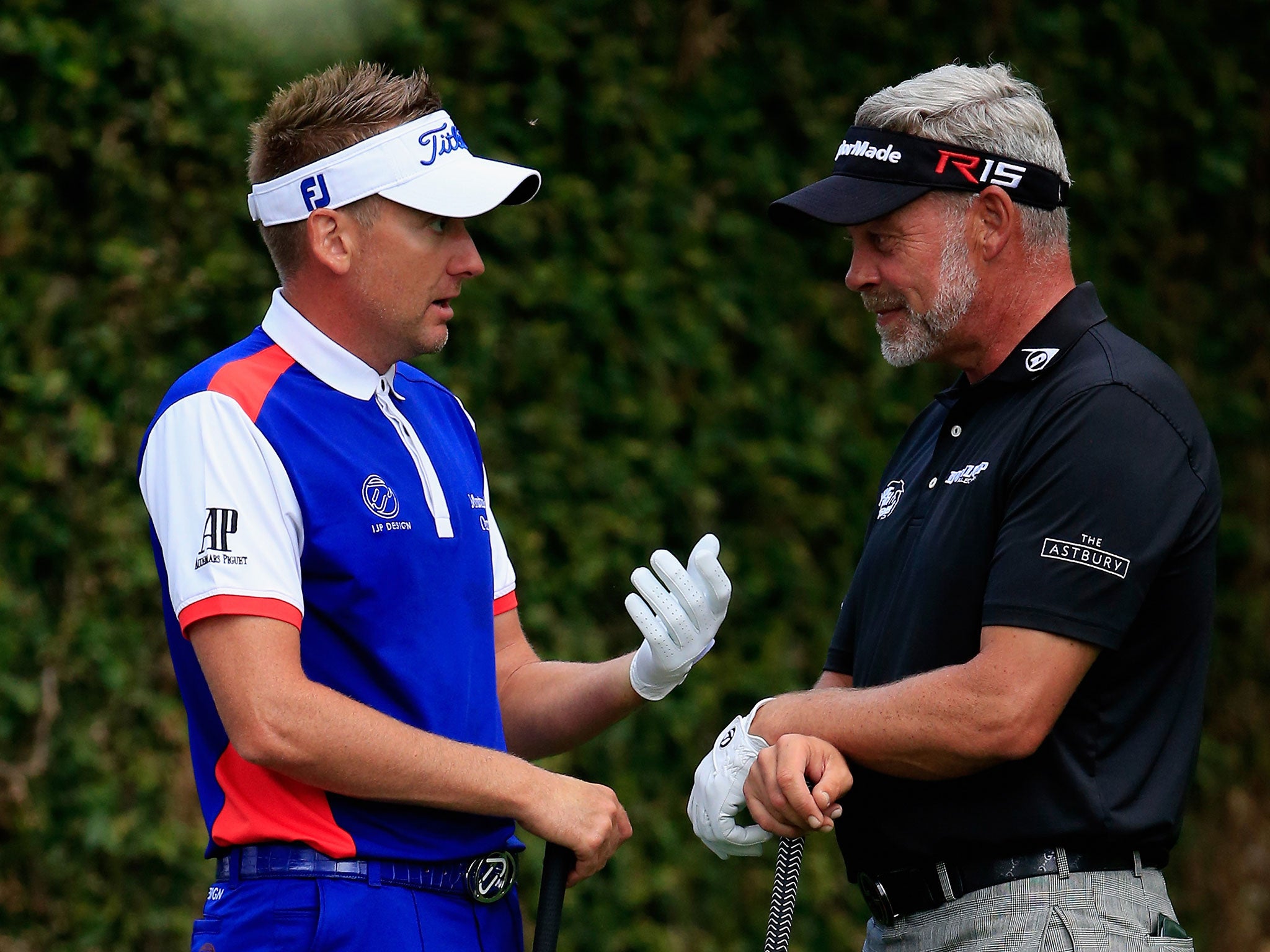 Ian Poulter speaks with Darren Clarke on the third day