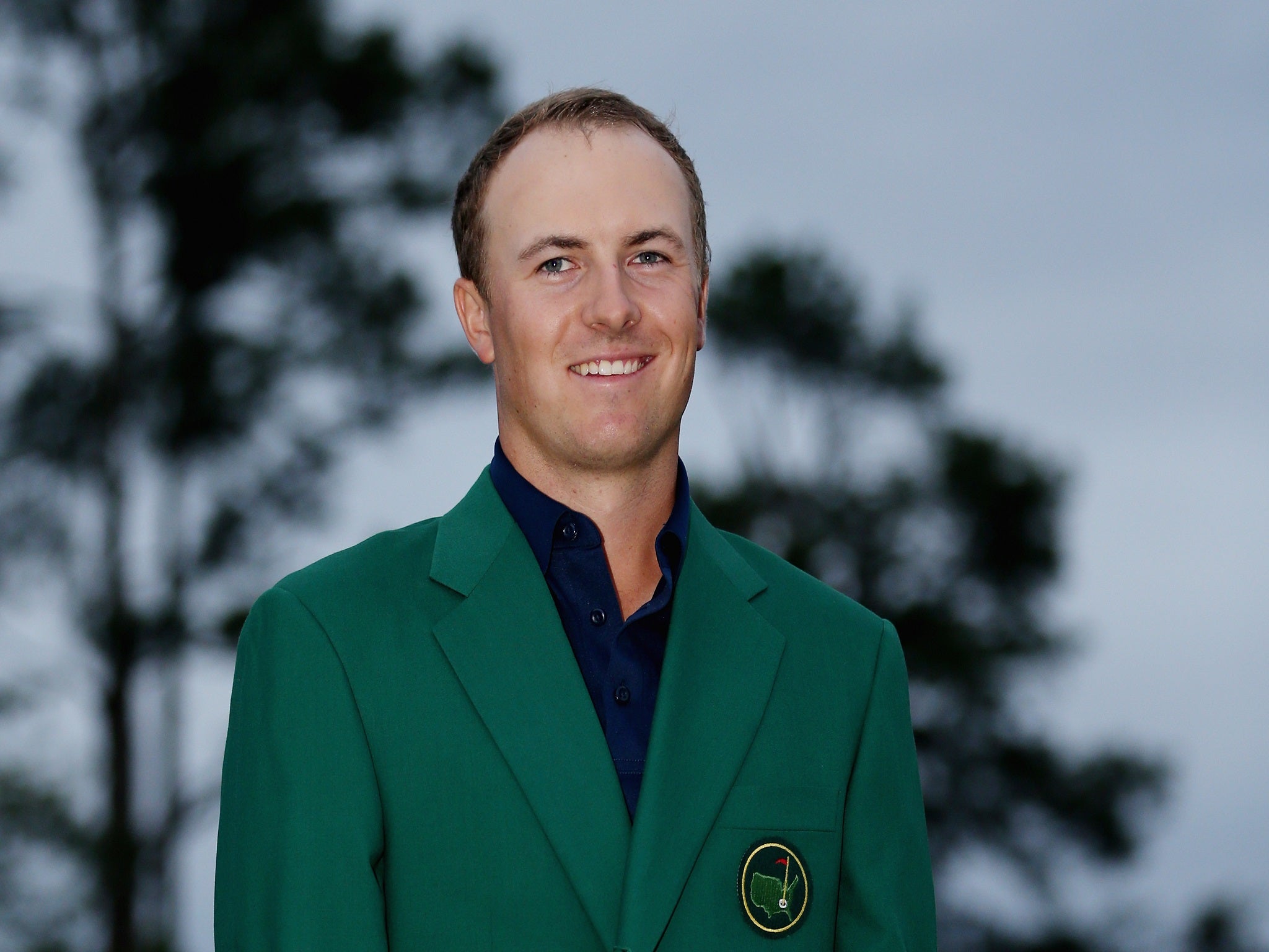Jordan Spieth celebrates his Masters victory as he wears the famous Green Jacket