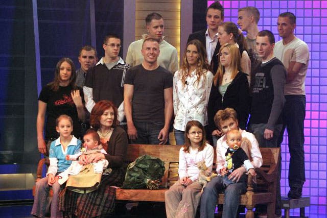 Raunigk, bottom row third left, pictured on a chat show with her children and grandchildren 