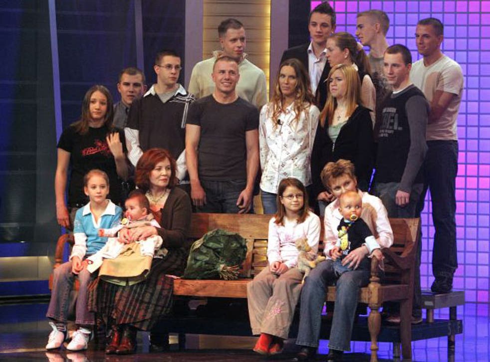 Raunigk, bottom row third left, pictured on a chat show with her children and grandchildren 