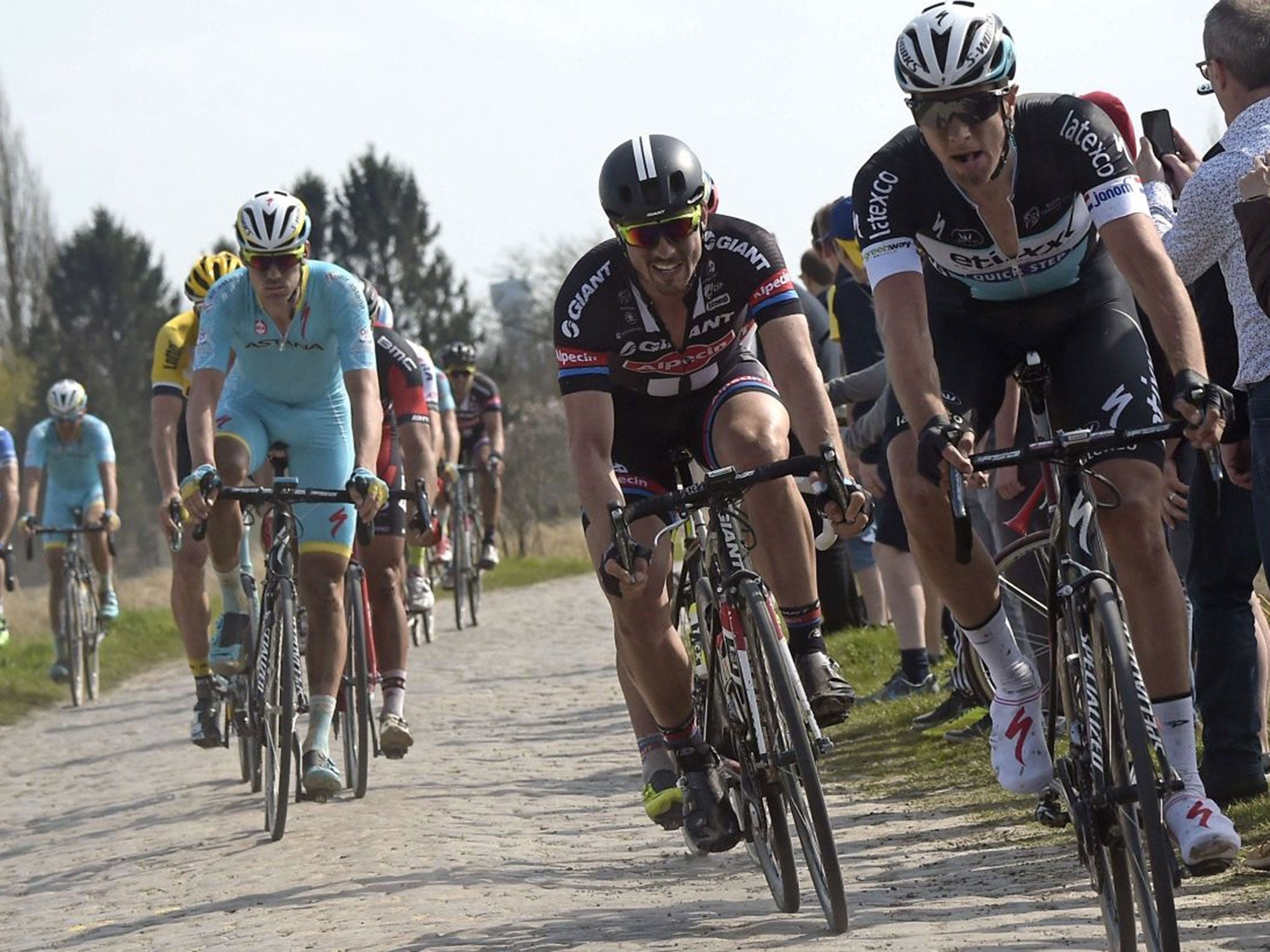 Team Giant-Alpecin German cyclist John Degenkolb rides to win the 113th edition of the Paris-Roubaix Paris-Roubaix one-day classic cycling race in Roubaix on April 12, 2015.