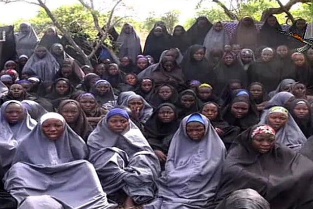 Boko Haram released a video of the kidnapped schoolgirls in 2014, where they appeared reasonably fit and well in a wooded location, followed by a rant from the group’s leader Abubakar Shekau (AFP)