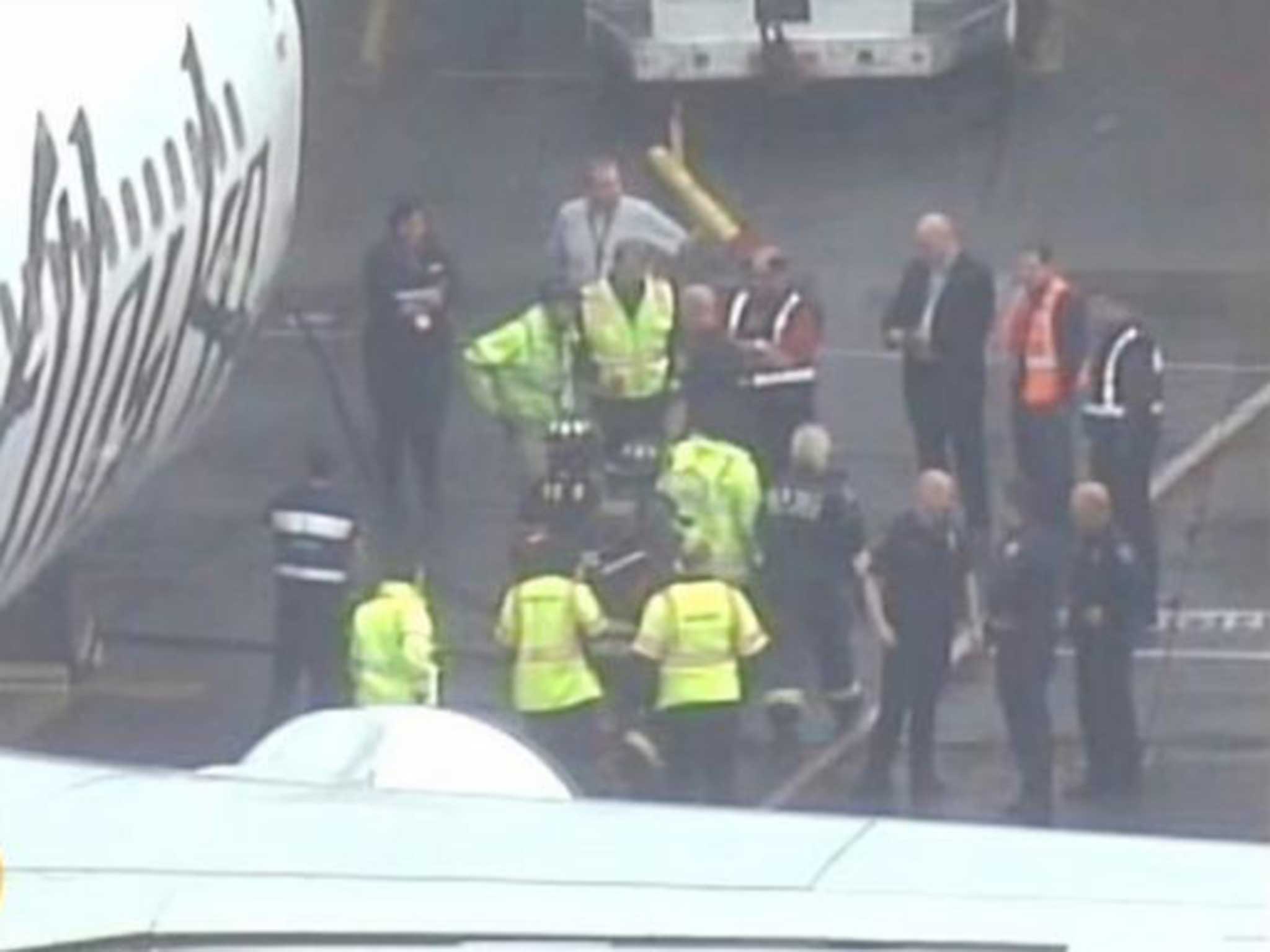 The worker is retrieved from the plane's hold