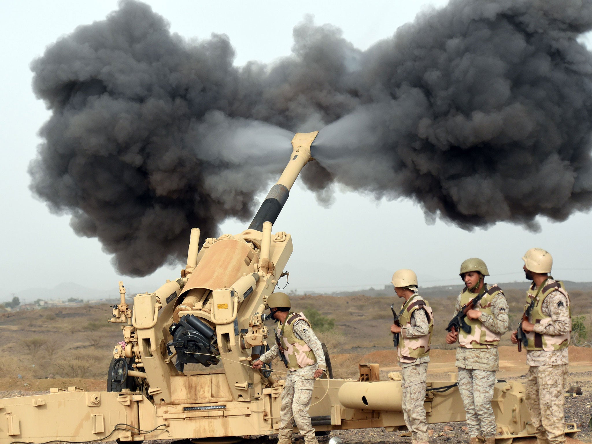 Saudi army artillery fire shells towards Yemen from a post close to the Saudi-Yemeni border