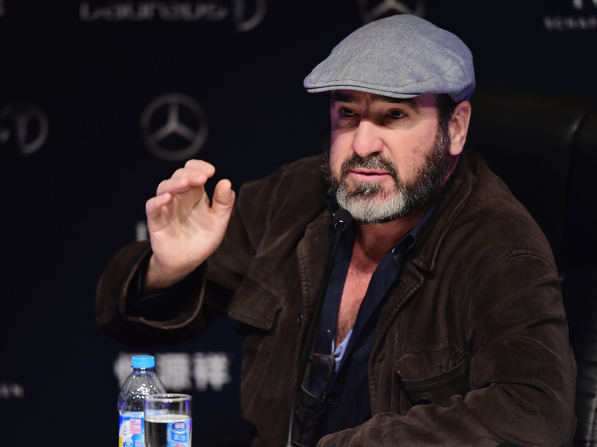 Eric Cantona speaks during a press conference at the Shanghai Grand Theatre prior to the Laureus World Sports Awards