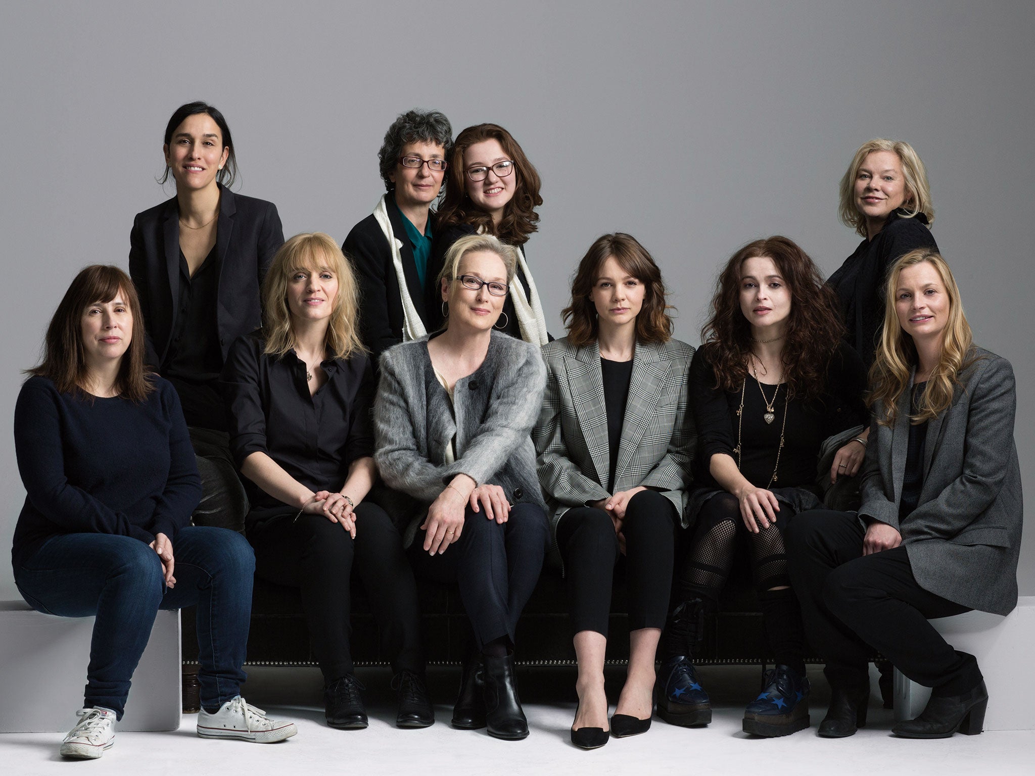 The women behind Suffragette pose to celebrate International Women's Day