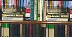 A closer inspection of the backdrop reveals many duplicate books