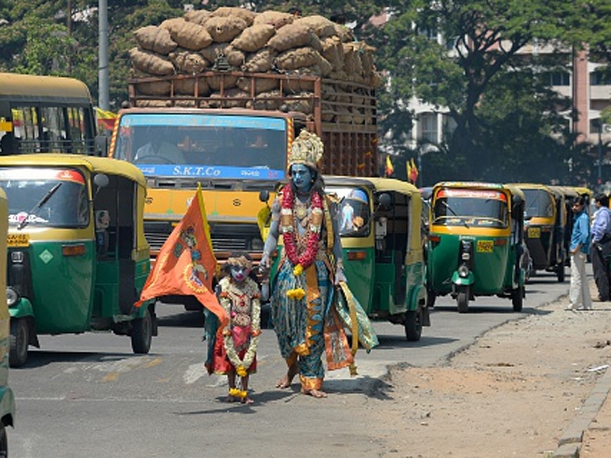 An Indian artist and his son dress in costume for a Hindu festival in Bangalore. India could be the world's fourth biggest economy by 2030.