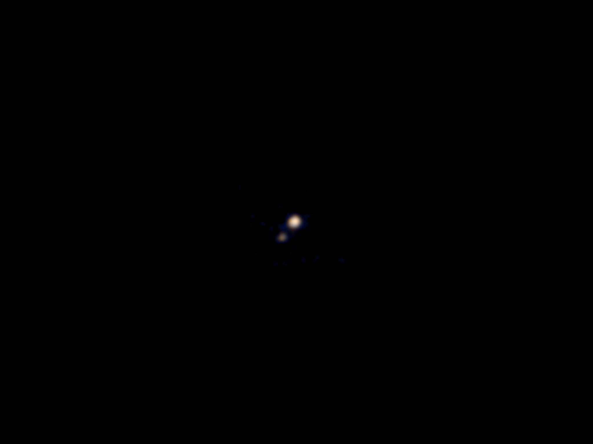 This image of Pluto and its largest moon, Charon, was taken by the Ralph color imager aboard NASA’s New Horizons spacecraft on April 9 and downlinked to Earth the following day. It is the first color image ever made of the Pluto system by a spacecraft on
