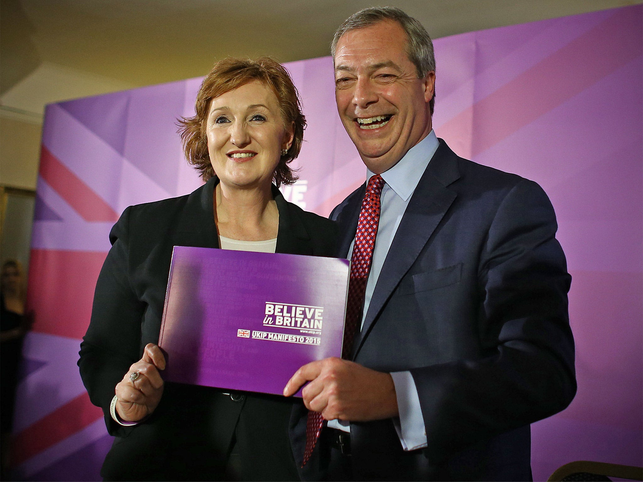 Ukip leader Nigel Farage and deputy chairman, Suzanne Evans, pose with the party manifesto during its launch in Thurrock
