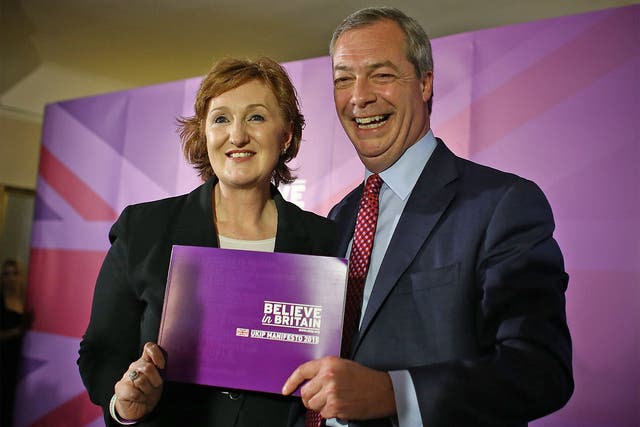 Ukip leader Nigel Farage and deputy chairman, Suzanne Evans, pose with the party manifesto during its launch in Thurrock