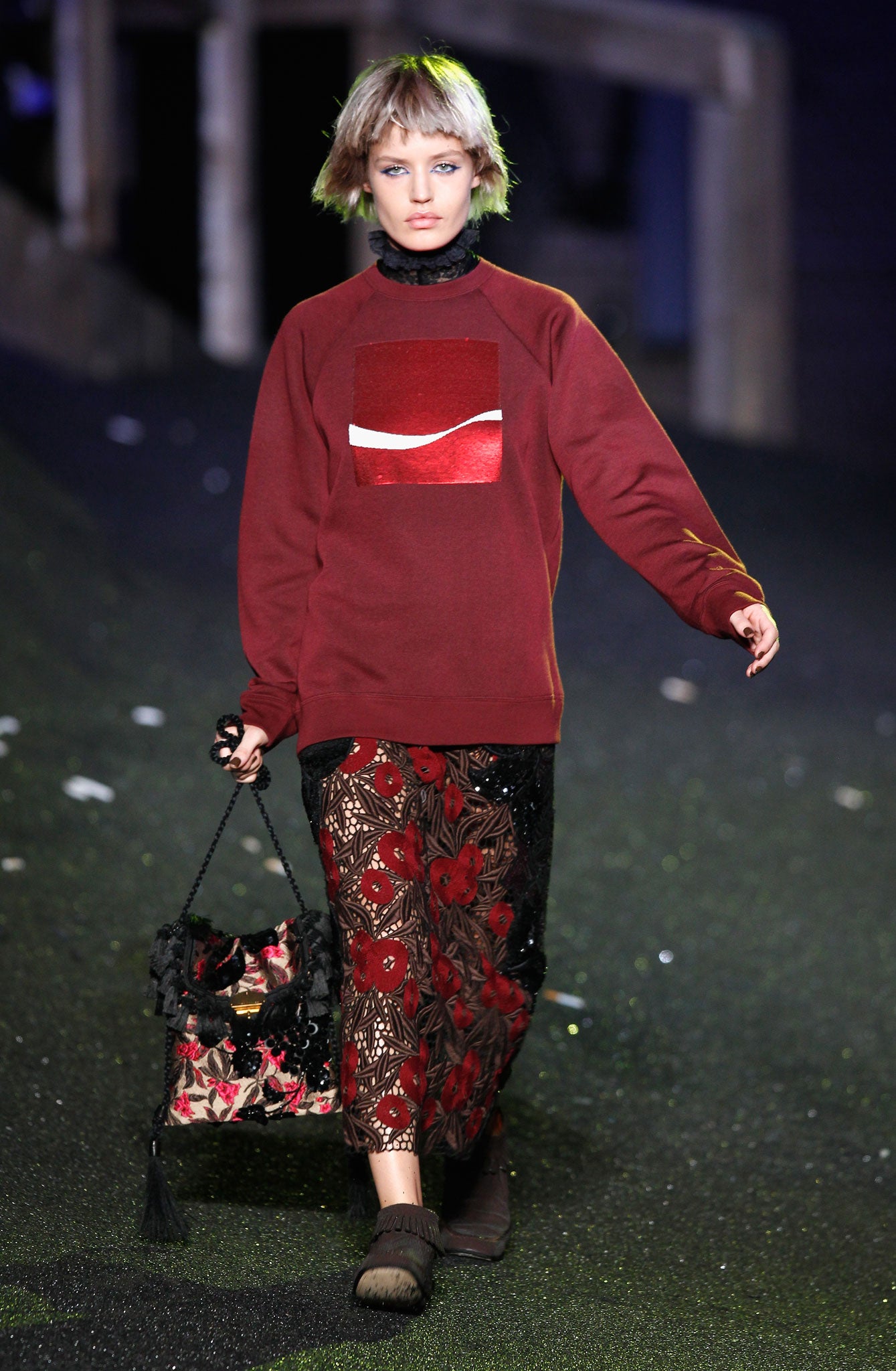 Marc Jacobs patterned a sweatshirt with the brand's 'Arden Square' shaded red logo, bisected with a white 'wave' (Getty)