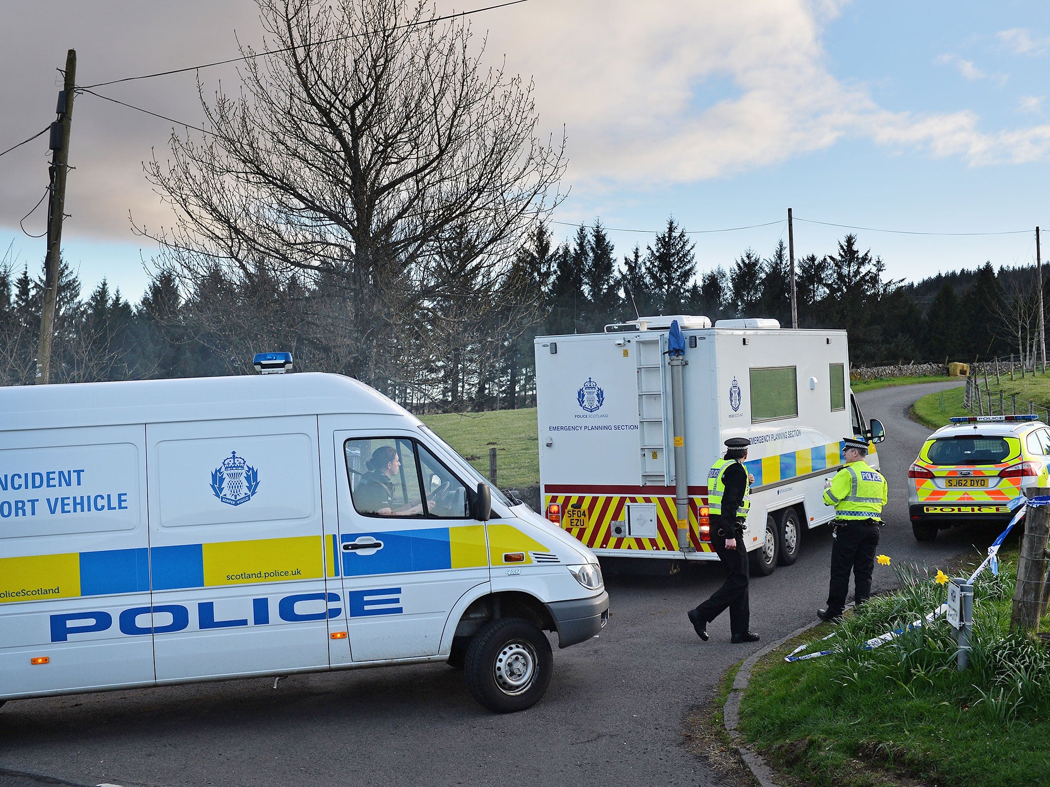 Police stand at the entrance to High Craigton Farm near Milngavie, where Karen Buckley's body was found