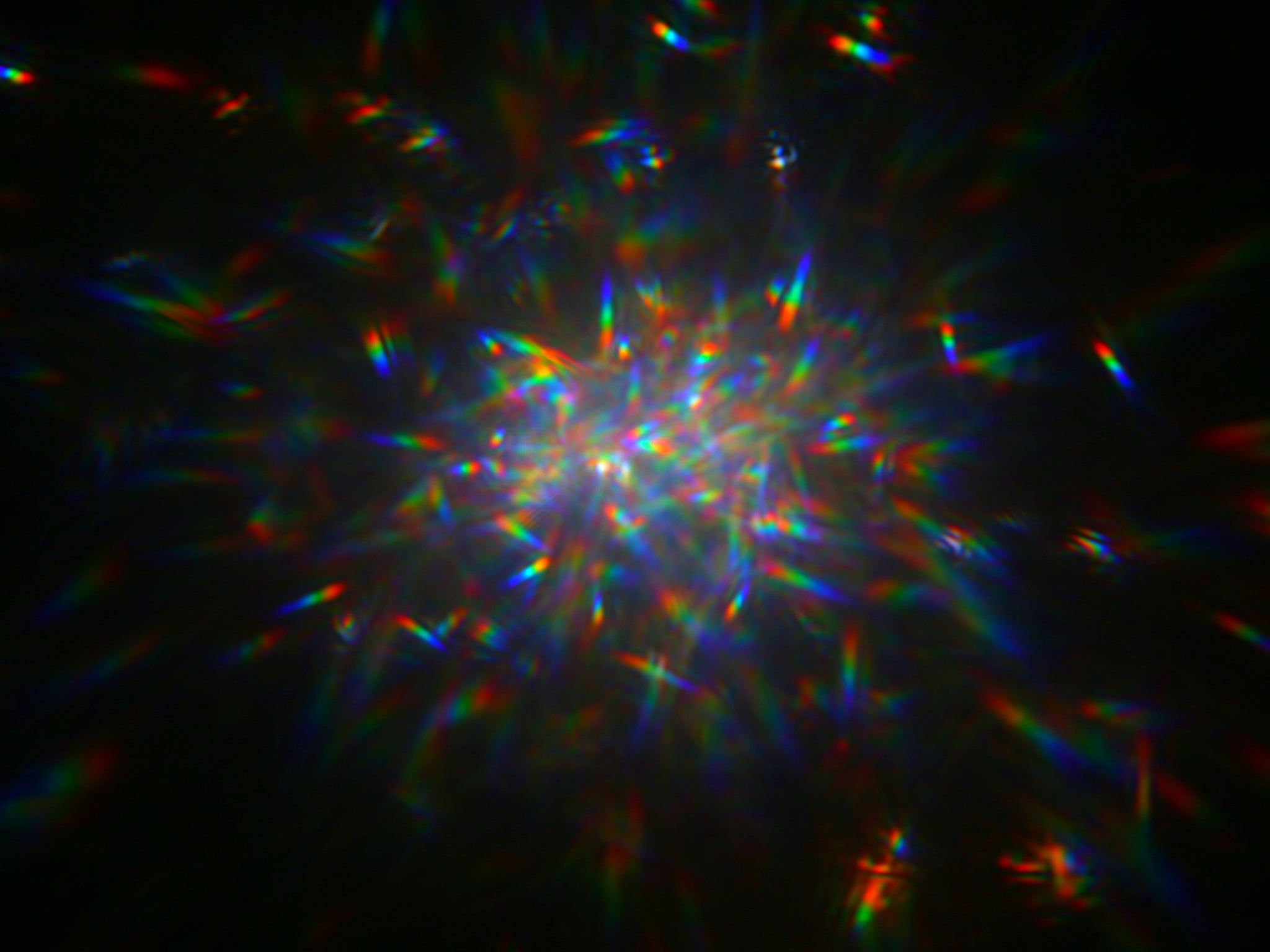 This image shows laser light reflected off of a glitter mirror onto a camera sensor. Researchers tested this in a laboratory as part of the concept of "Orbiting Rainbows," a low-cost solution for space telescope mirrors