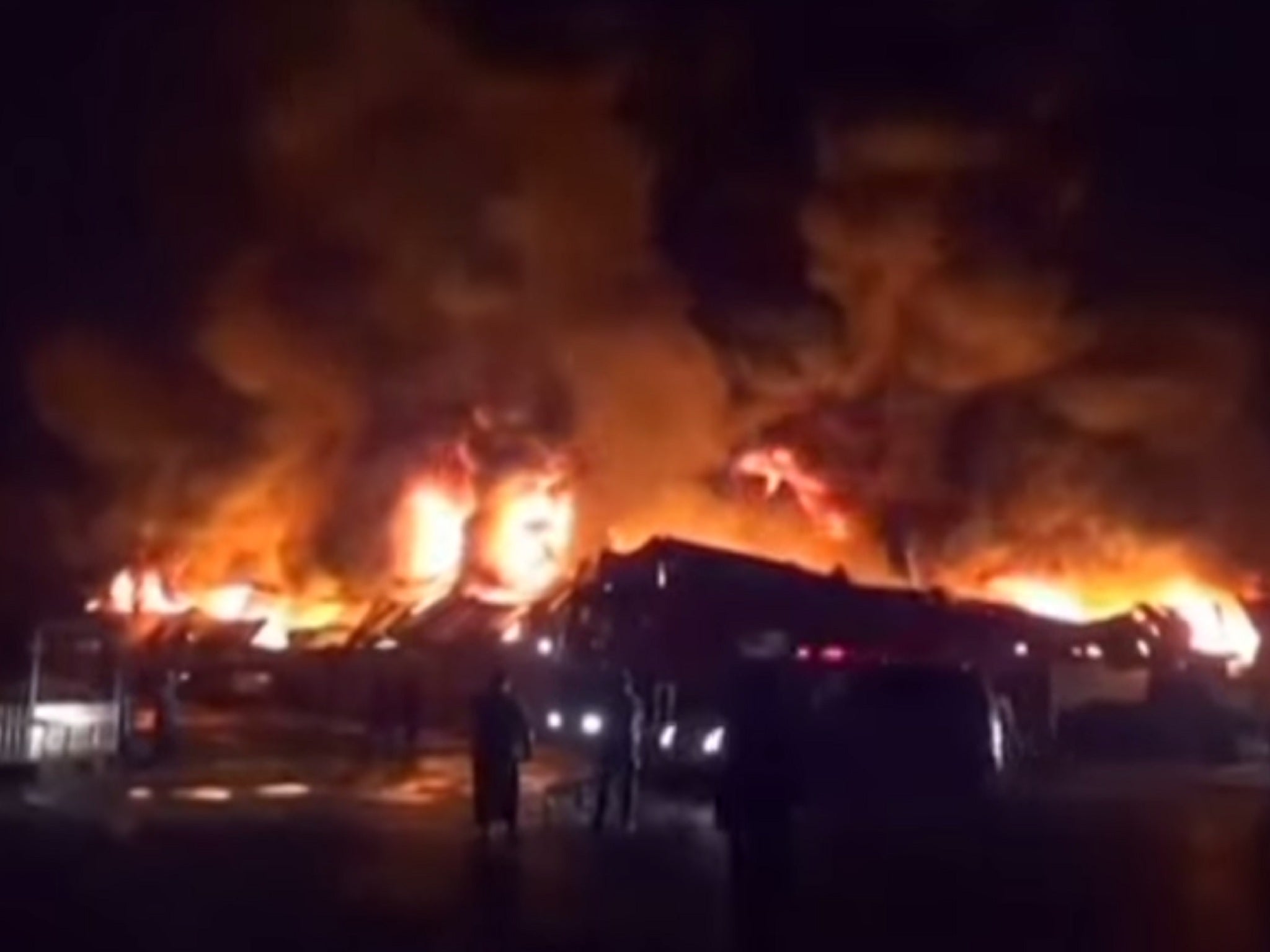 The burning factory after at least 31 people died in Hodaida, Yemen