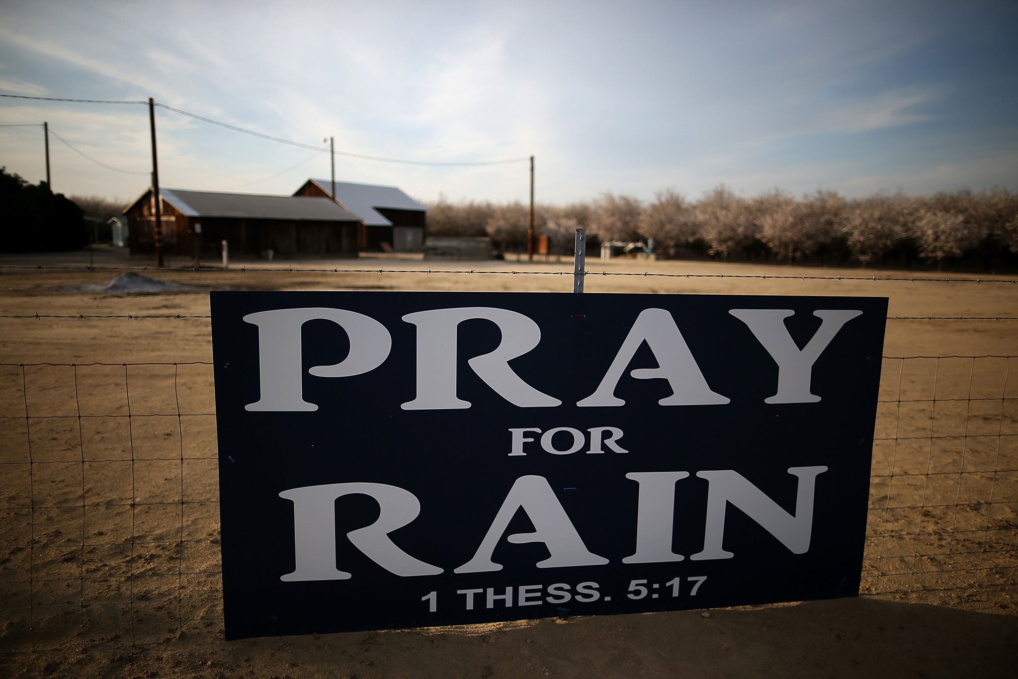 A sign is posted near an almond farm in Turlock, California.