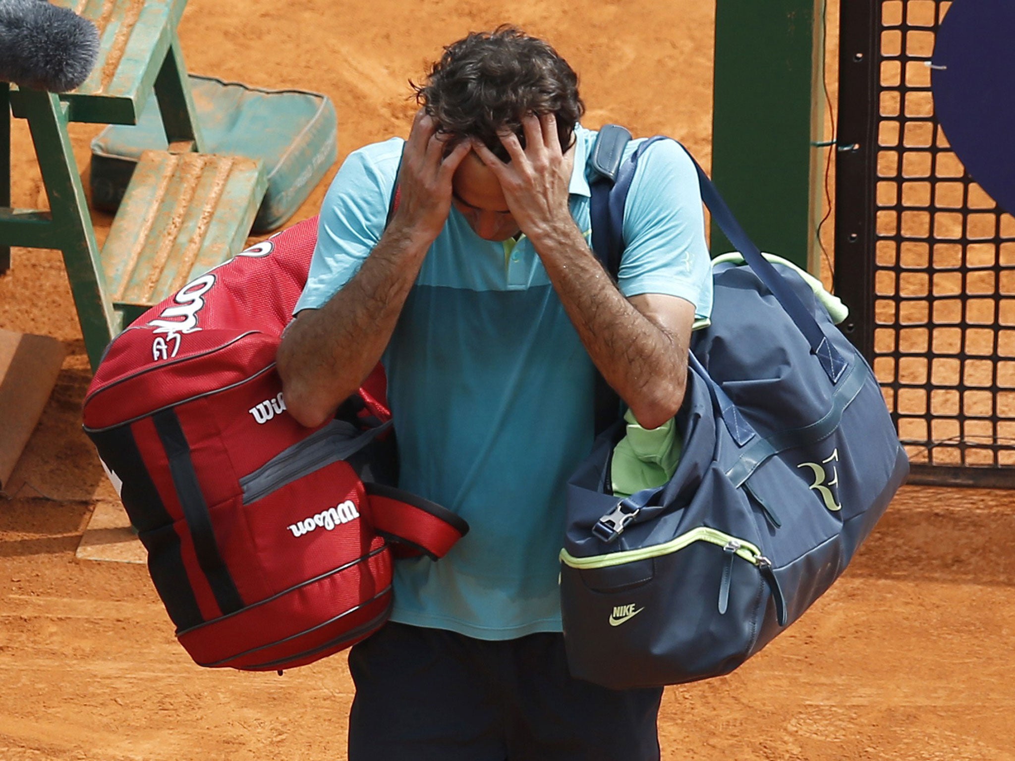 Roger Federer reacts after losing to Gael Monfils in the Monte Carlo Masters