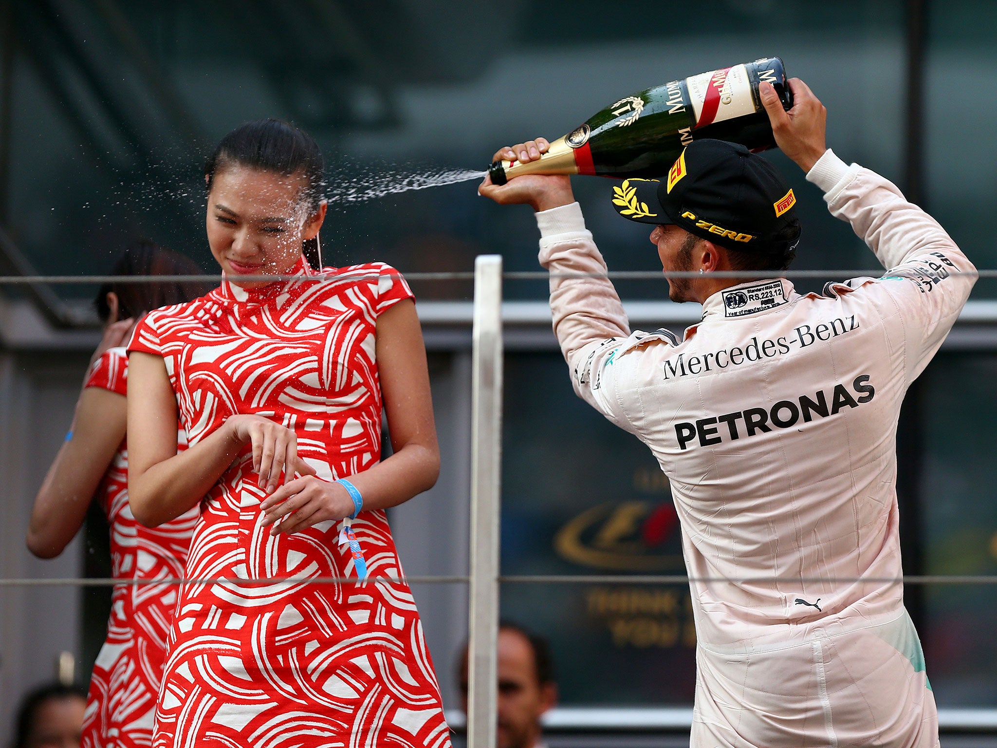 Hamilton was criticised for spraying Chinese model Liu Siying with champagne