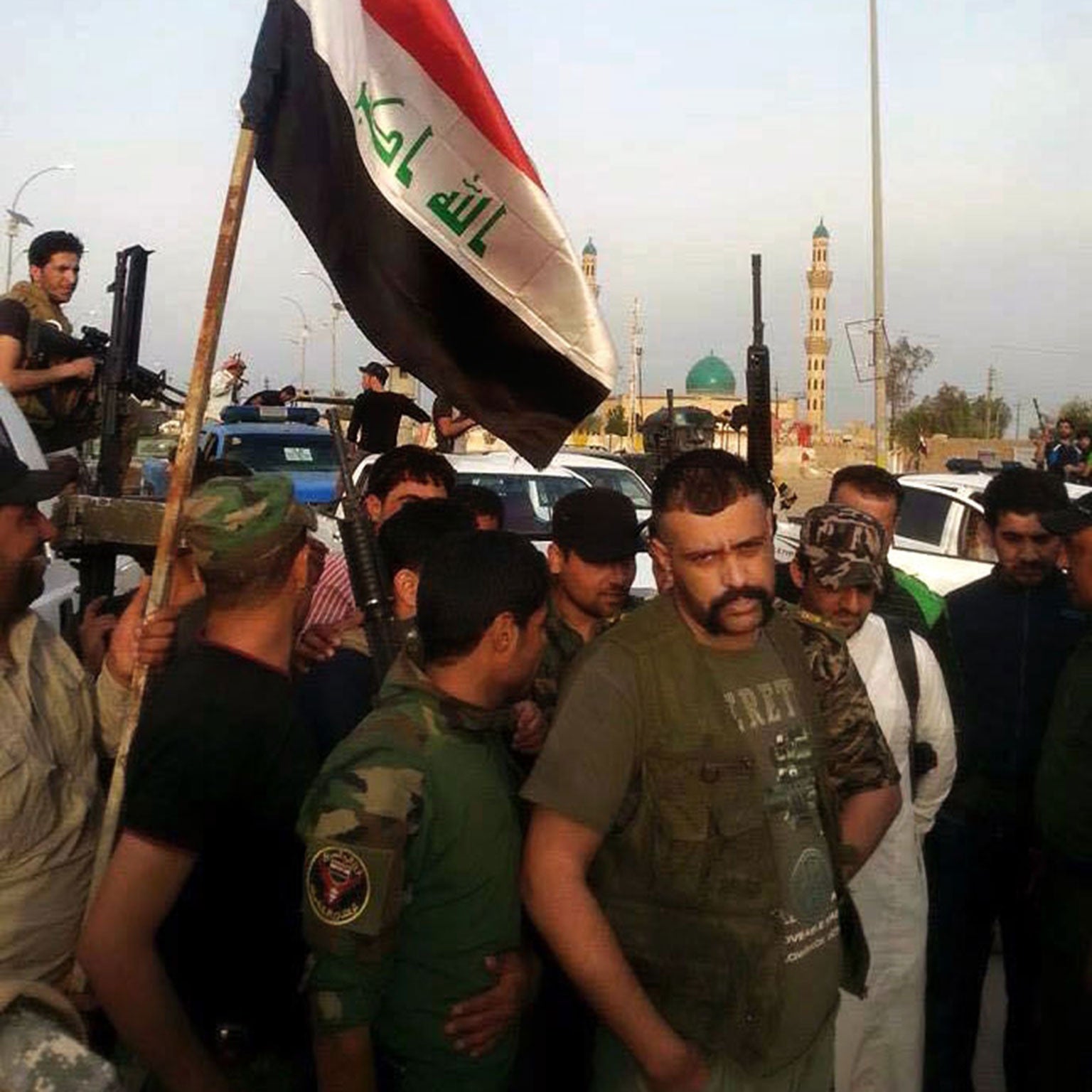 Iraqi security forces and tribal fighters gather in central Ramadi before attacking Isis