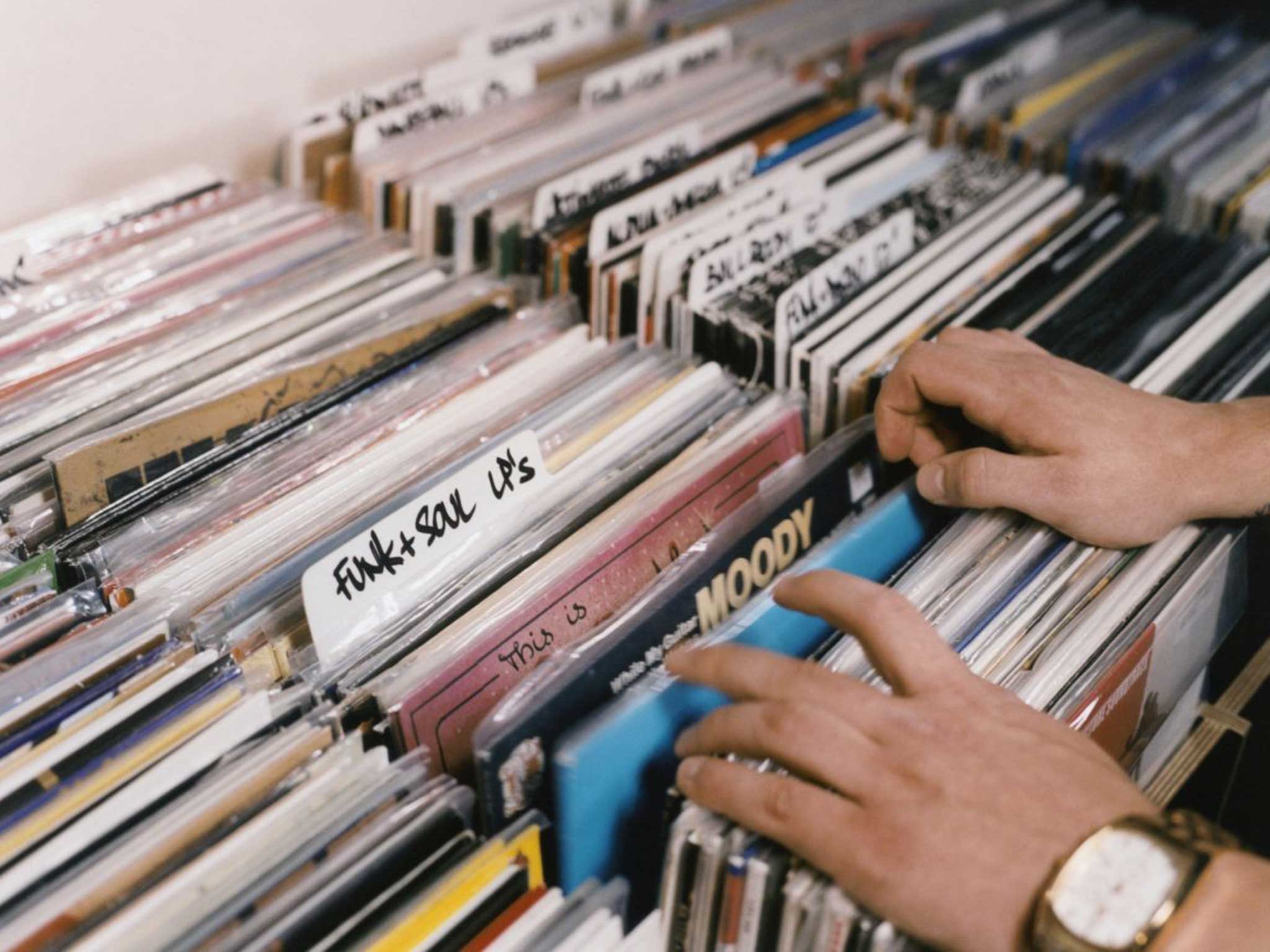 Art on their sleeves: before downloads and streaming, enthusiasts used to flick through racks of albums in their local record shops