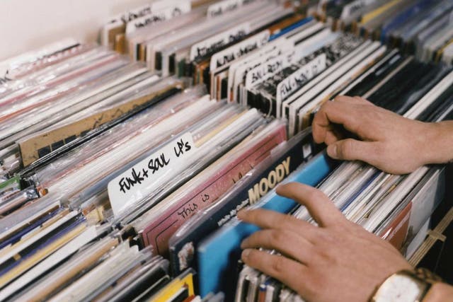Art on their sleeves: before downloads and streaming, enthusiasts used to flick through racks of albums in their local record shops 