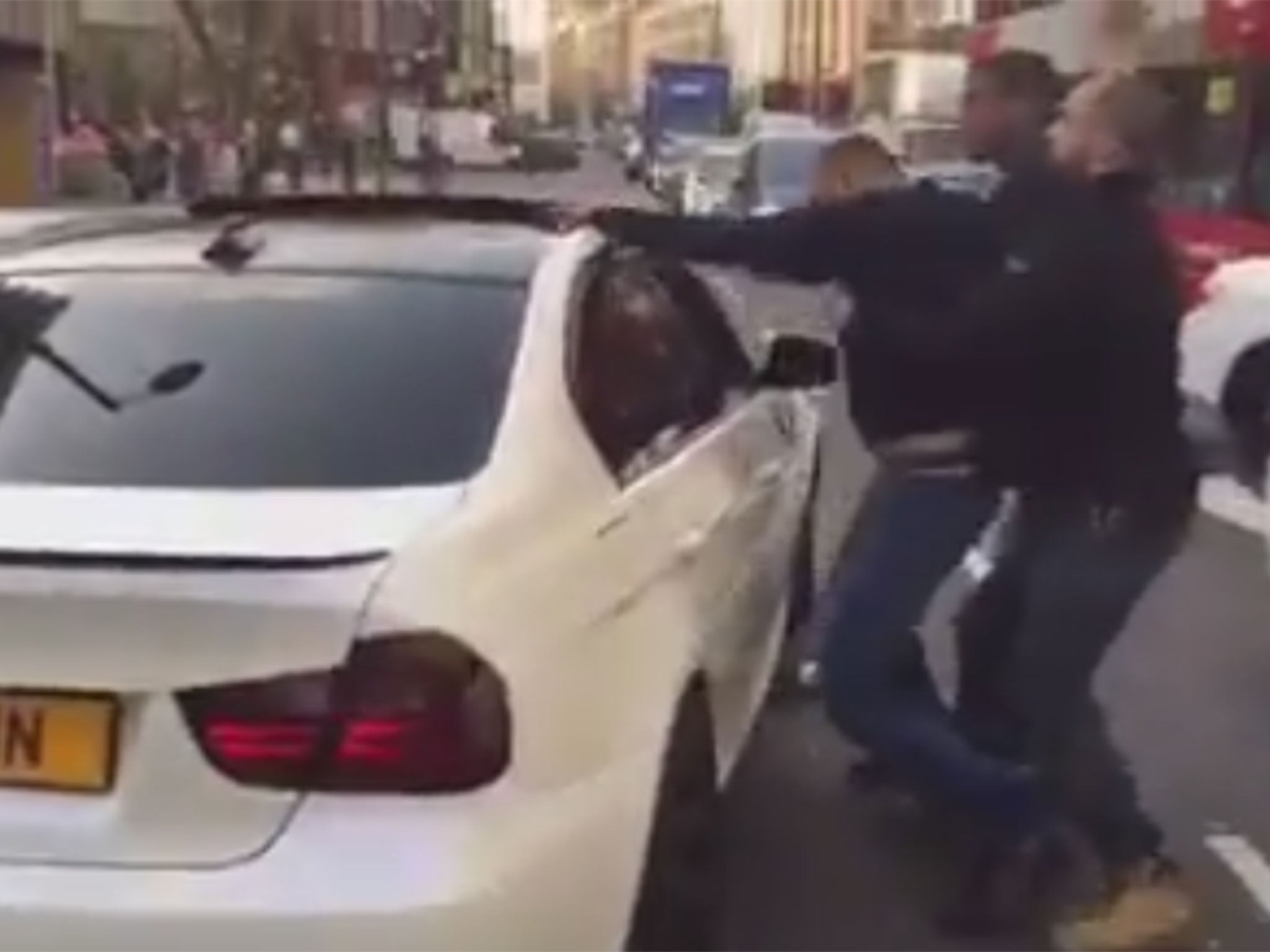 The man appeared to hit the driver of the BMW before being rammed