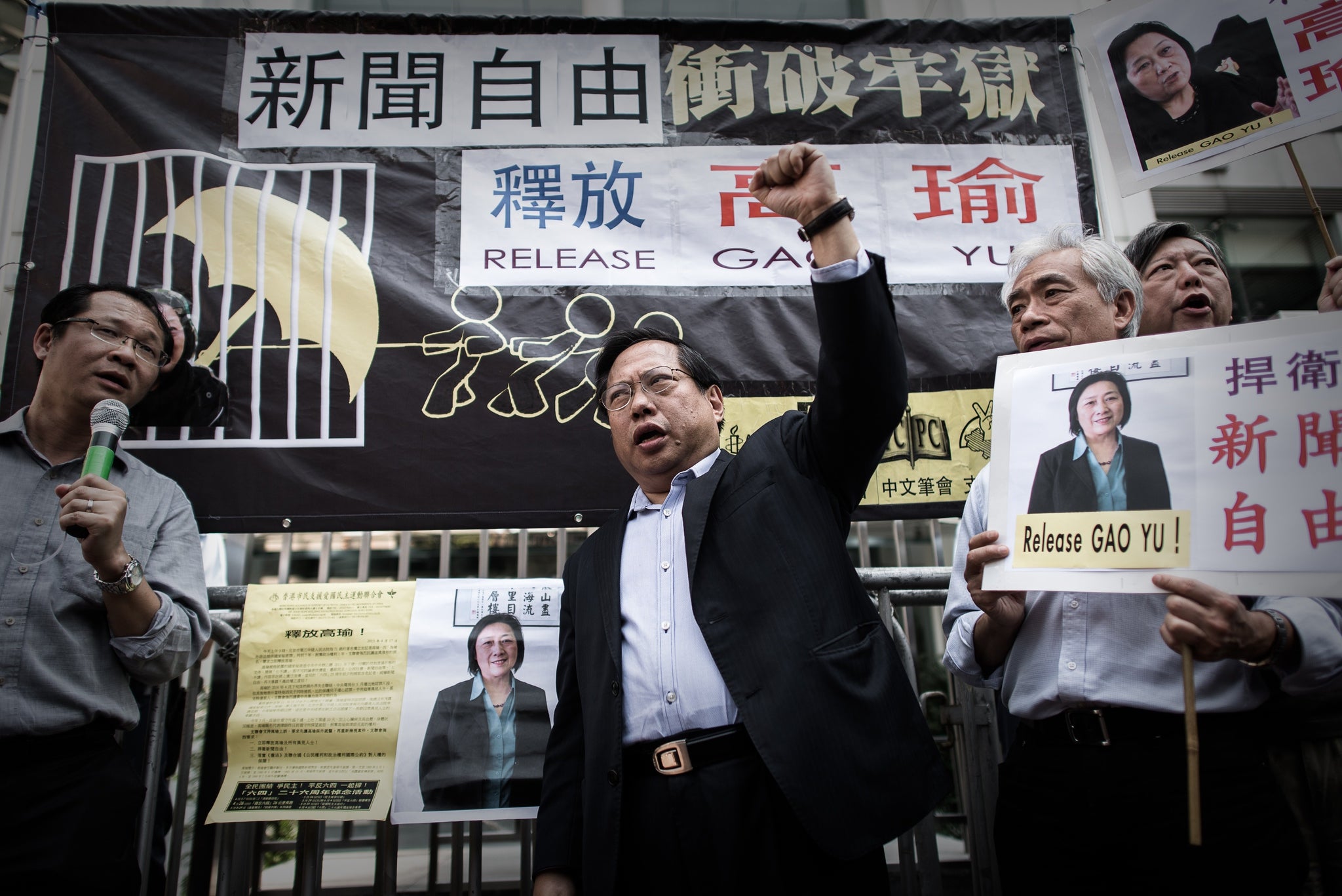 Albert Ho, of the Hong Kong democratic party, shouts slogans today outside Hong Kong's China liason office in support of Gao Yu and press freedom