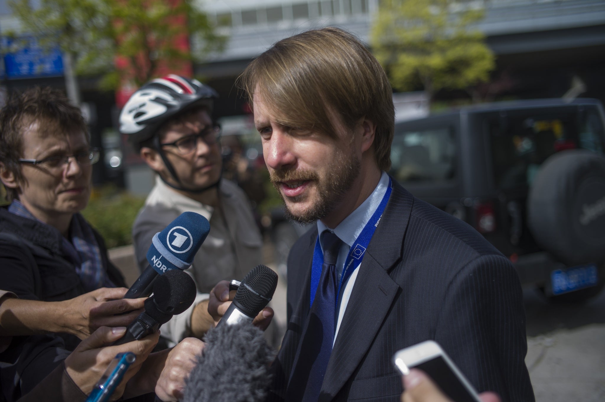 Raphael Droszewski, first secretary of Political Affairs at the European Union, talks to journalists after the trial, saying the trial has heightened the EU's concerns over the situation of human rights defenders in China