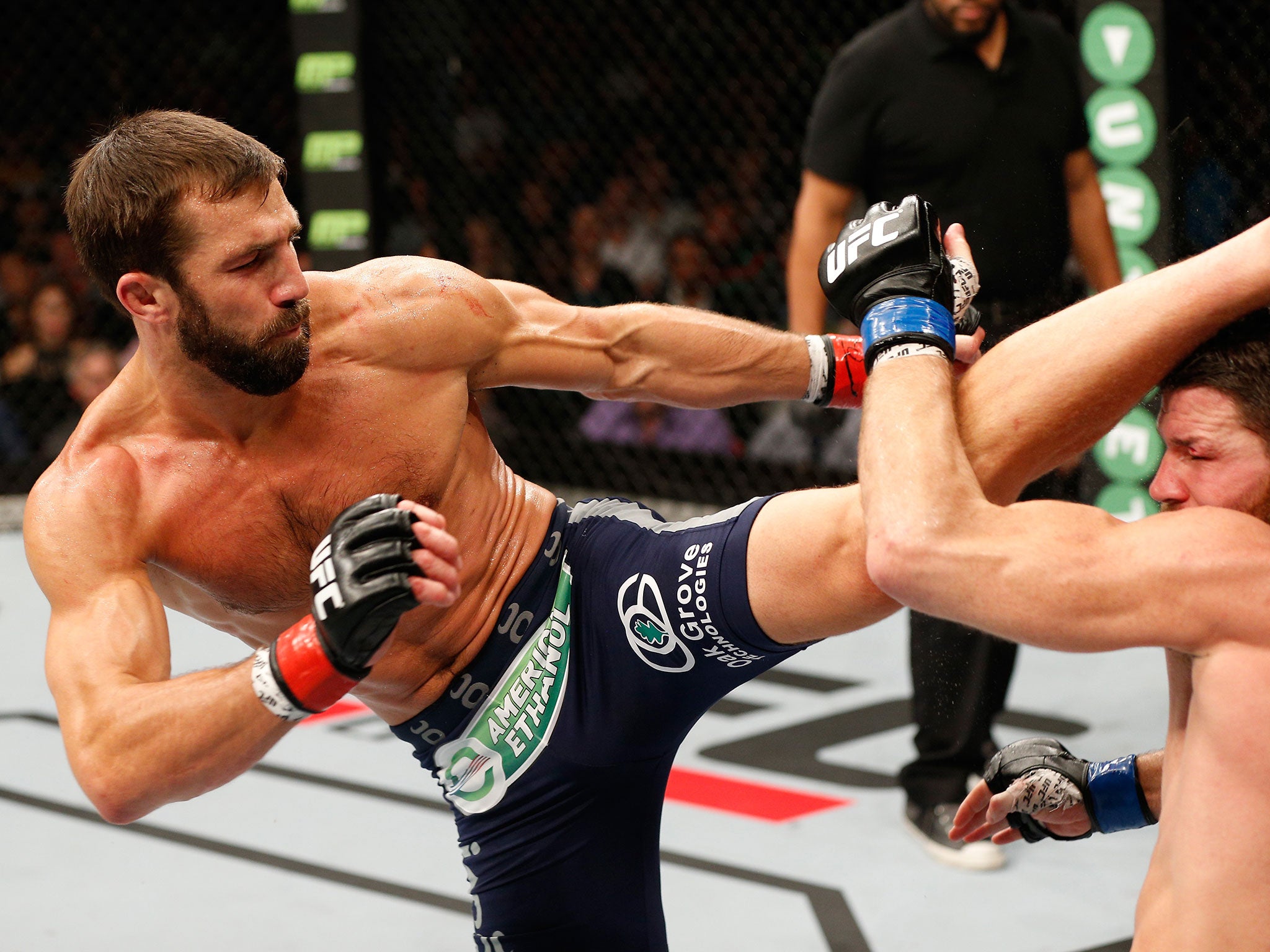 Luke Rockhold kicks Michael Bisping