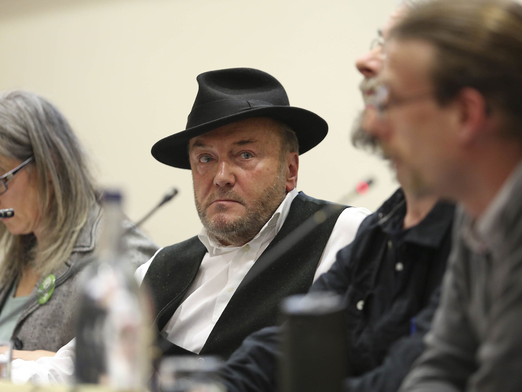 Around 200 university staff and students gathered for the Bradford West hustings where George Galloway was sat well away from his Labour rival Naz Shah