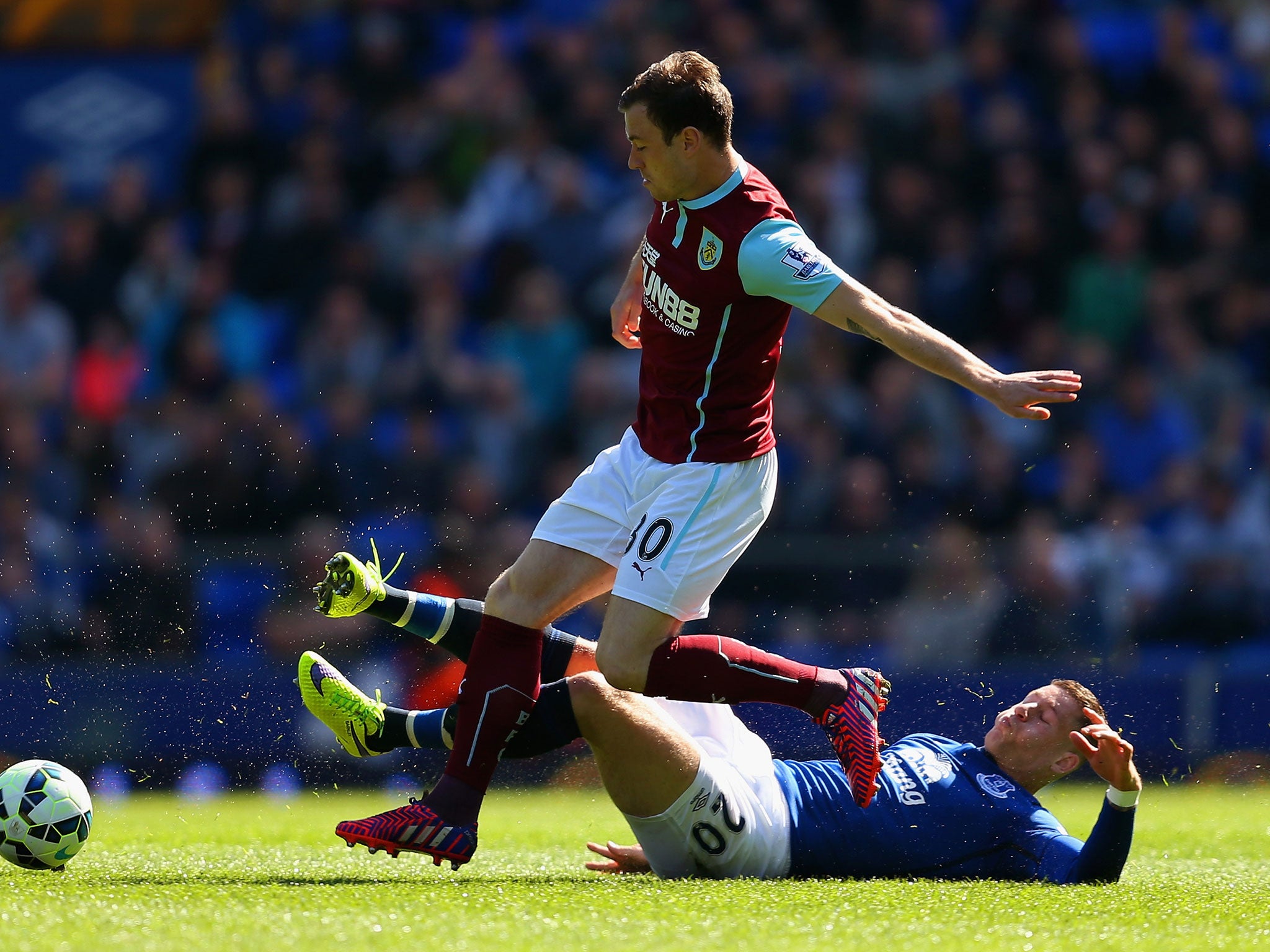 Ashley Barnes clashes with Ross Barkley for possession