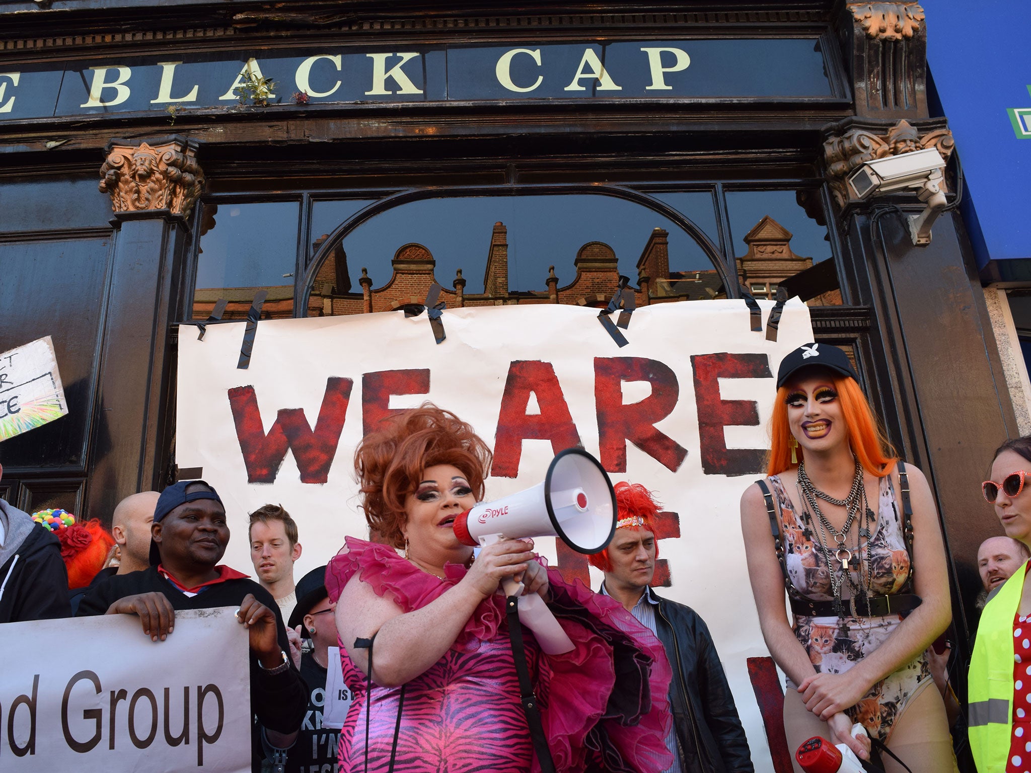 Drag queens Titti La Camp (with megaphone) and Meth at the Black Cap protest