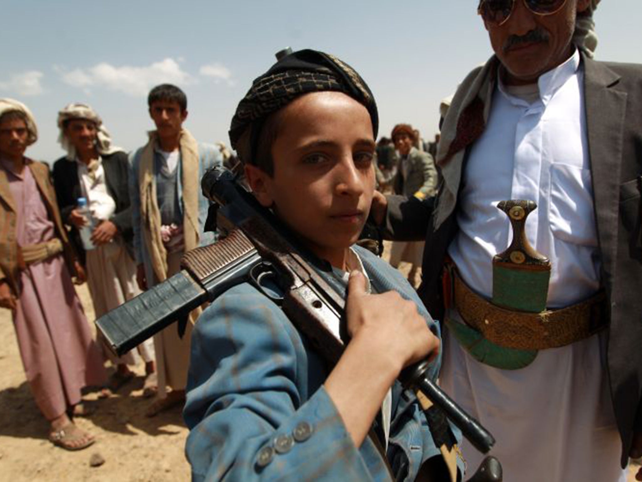 (FILE PHOTO) A Yemeni boy loyal to the Houthi rebels