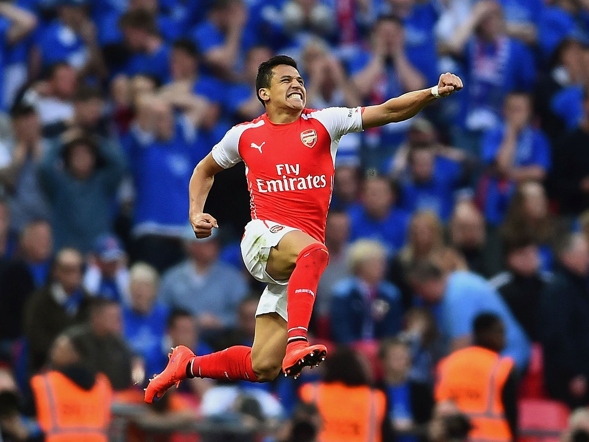 Alexis Sanchez celebrates scoring a second for Arsenal against Reading