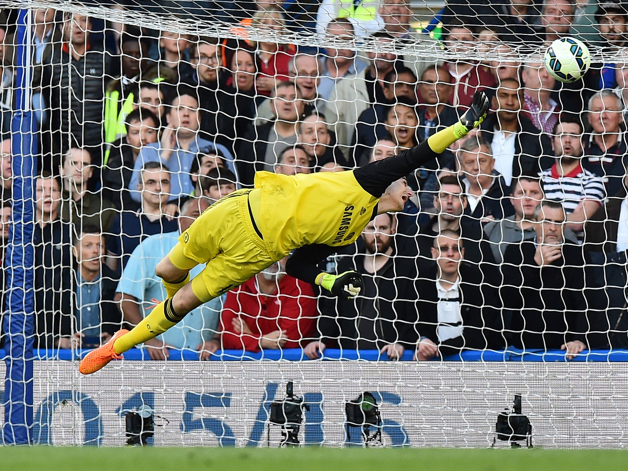 Thibaut Courtois stretches to make a save