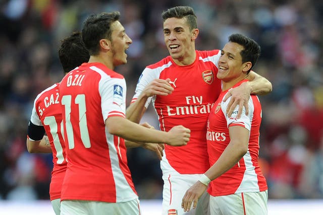 Arsenal players celebrate beating Reading in the FA Cup semi-final