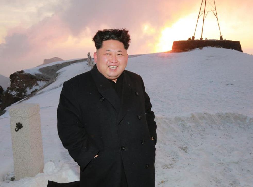 Kim Jong-un posing on top of Mount Paektu in North Korea