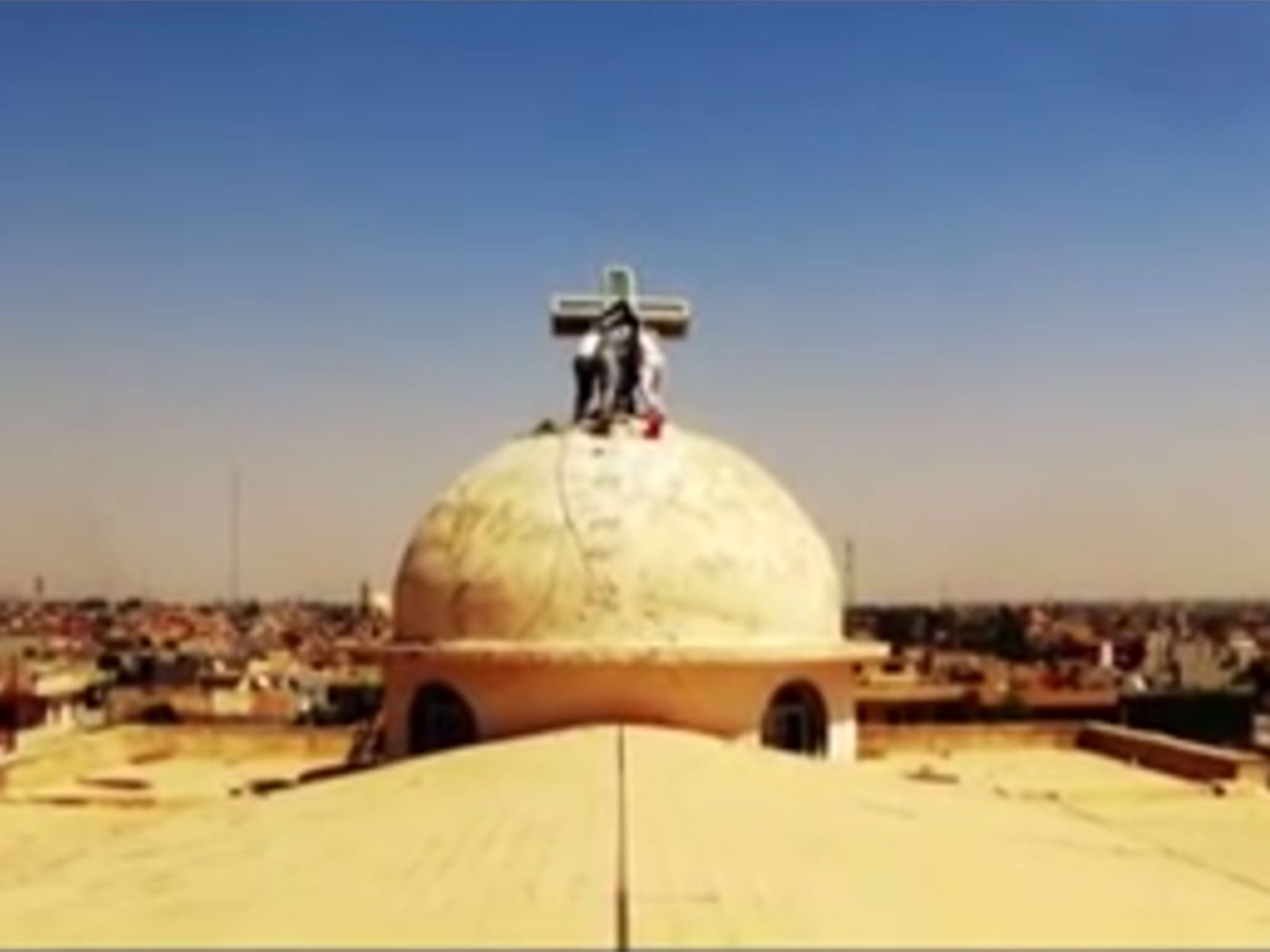 The new video showed Isis militants tearing crosses from Christian churches