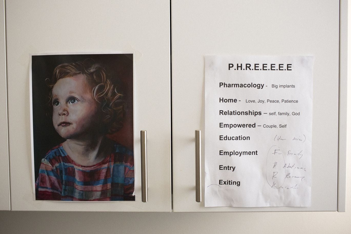 PHREEEEE: the guiding principles of the Fresh Start clinic next to a painting of founder Dr George O'Neil's granddaughter