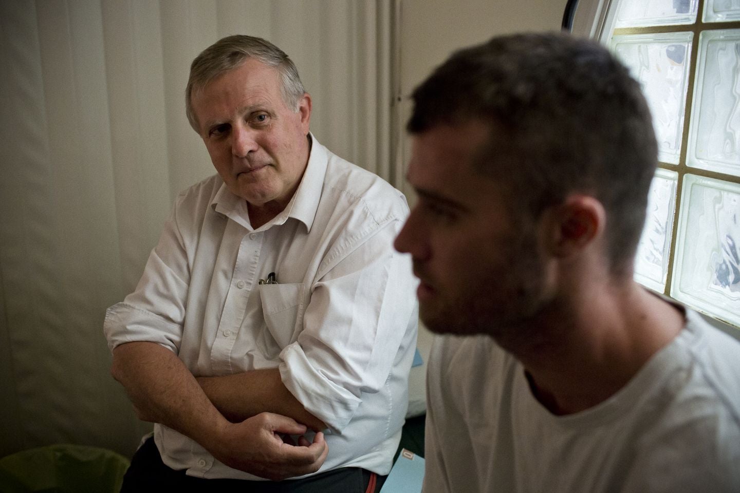 Dr George O'Neil chats with a client about to receive an implant at his Fresh Start clinic in Perth