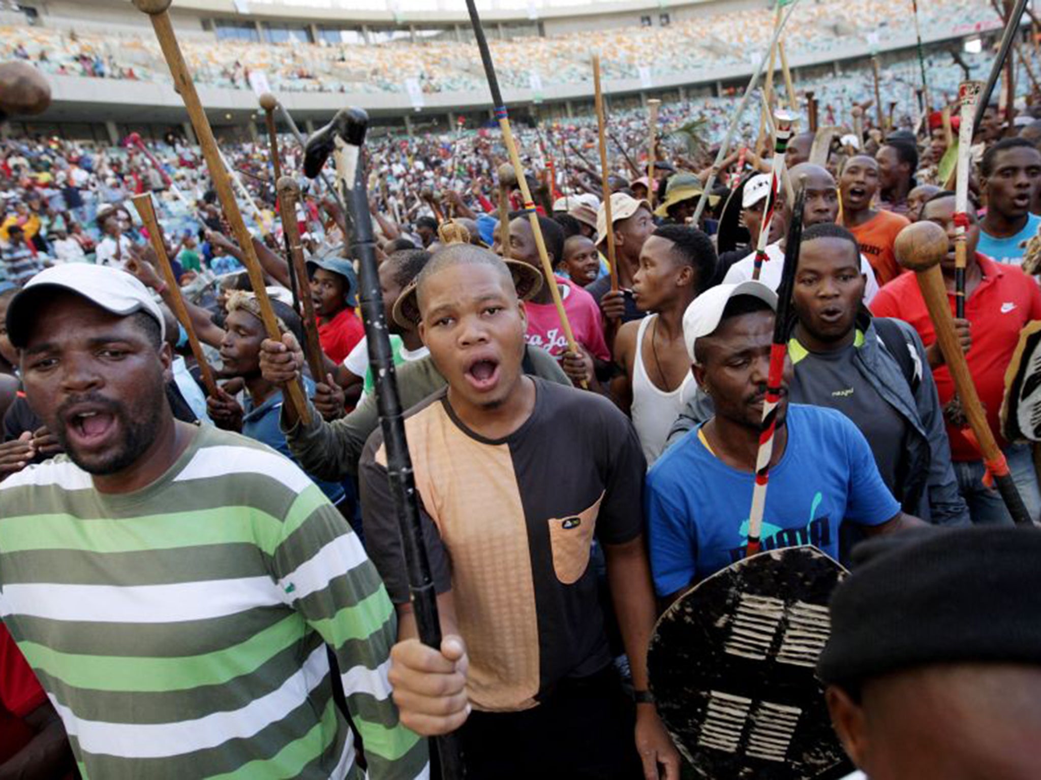 People gather to listen to the Zulu King's speech at the Moses Mabhida Football Stadium in Durban. King Zwelithini has denied whipping up xenophobic hatred in South Africa