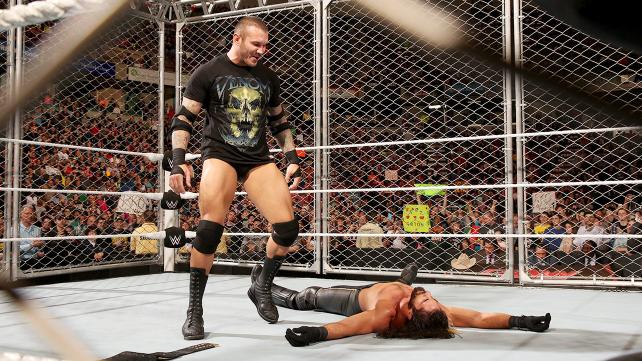 Randy Orton looks down on Seth Rollins after delivering an RKO