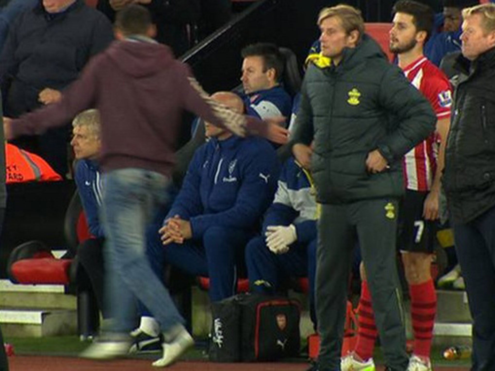 Arsene Wenger is confronted by the fan