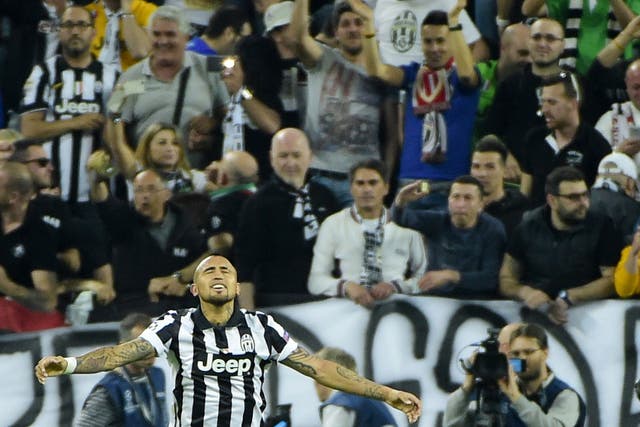 Juventus midfielder Arturo Vidal celebrates hiss goal against Monaco