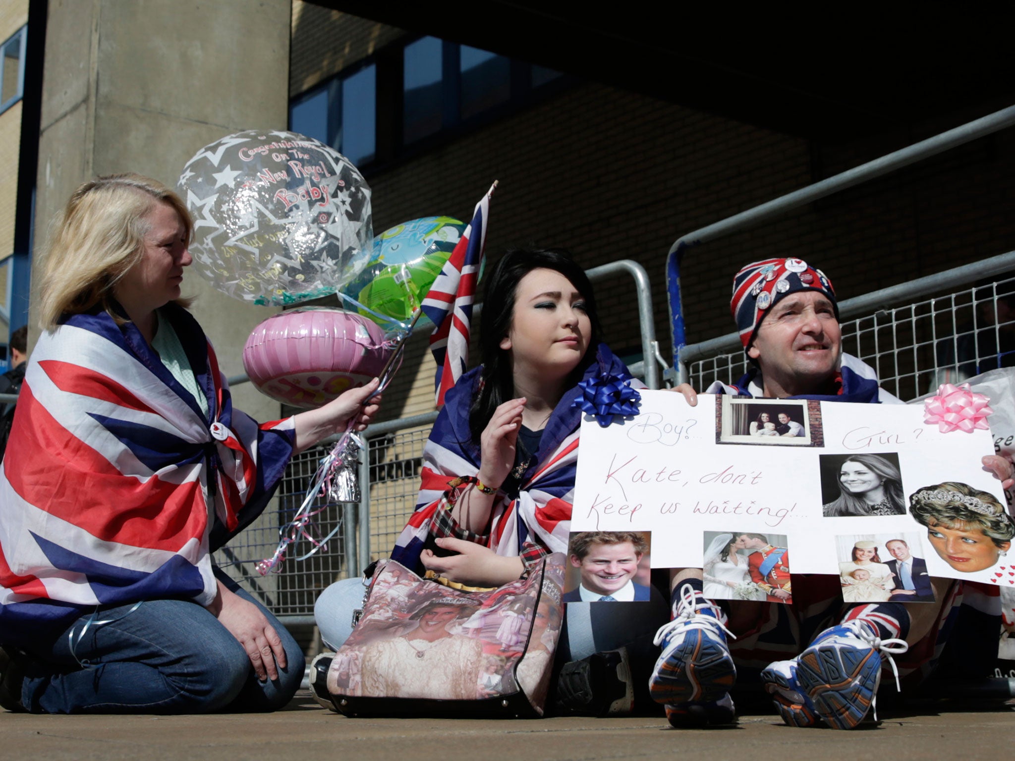 Royal fans Maria Scott, left Amy Thompson and John Loughrey