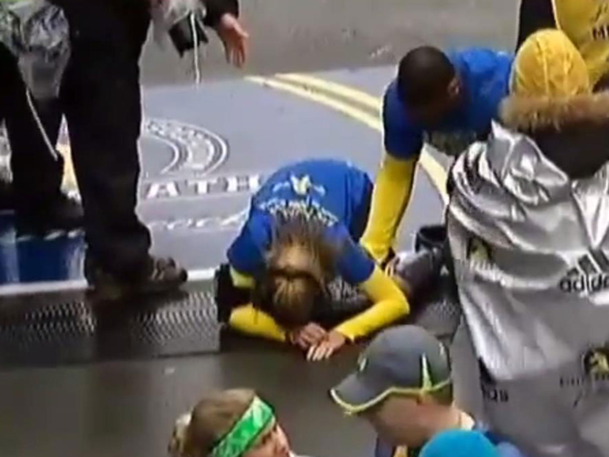 Rebekah Gregory crosses the finishing line of the Boston Marathon two years after she almost died in the bombings